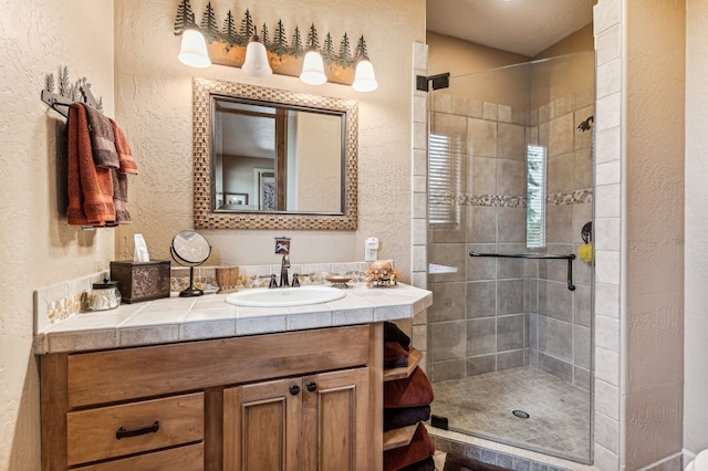 bathroom with vanity and an enclosed shower