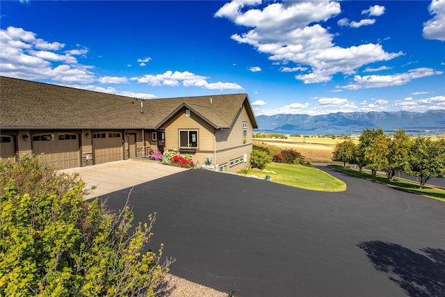 view of front of house featuring a mountain view and a garage