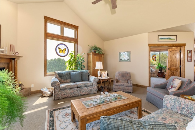 living area with baseboards, carpet, ceiling fan, and high vaulted ceiling