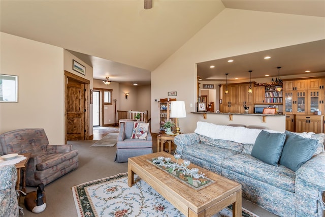 living area featuring recessed lighting, high vaulted ceiling, and light carpet