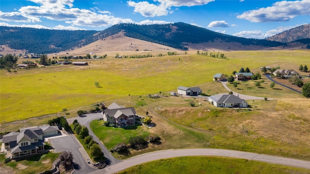 birds eye view of property with a mountain view and a rural view