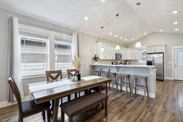 dining room featuring lofted ceiling, baseboards, dark wood-style flooring, and recessed lighting