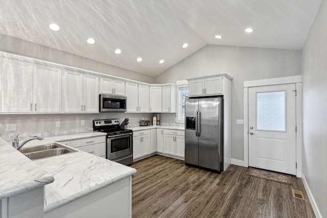 kitchen featuring dark wood-type flooring, white cabinetry, sink, and stainless steel appliances