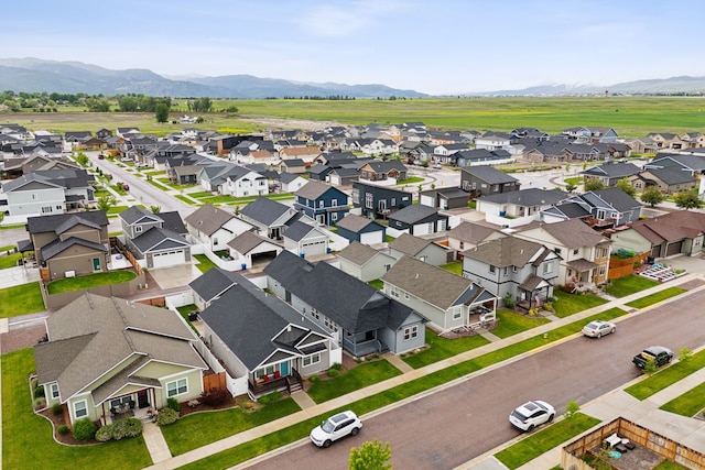 birds eye view of property featuring a mountain view