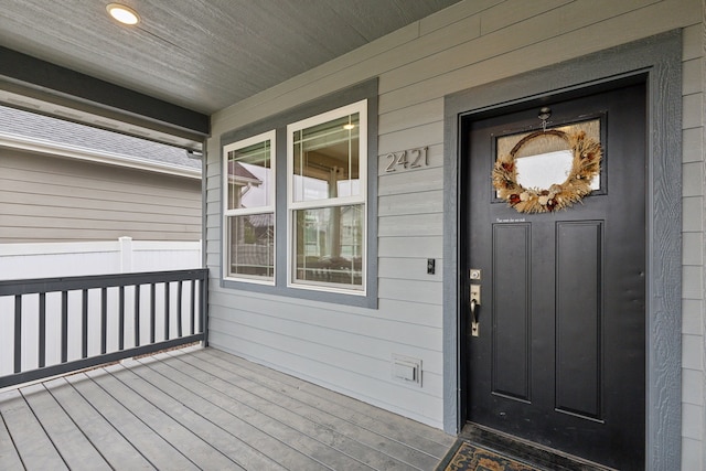 property entrance featuring covered porch