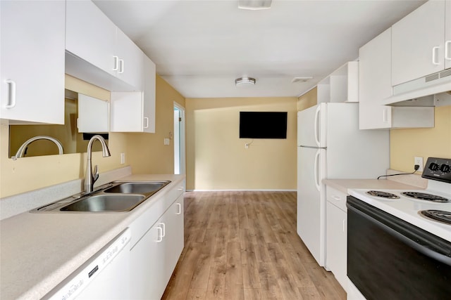 kitchen with sink, white cabinetry, light wood-type flooring, and white appliances