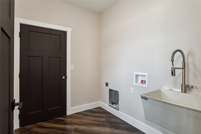 laundry area featuring washer hookup, sink, and dark wood-type flooring