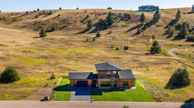 birds eye view of property with a rural view