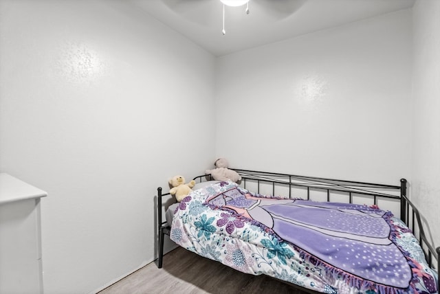 bedroom with ceiling fan and wood-type flooring