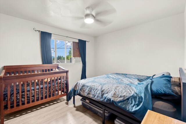 bedroom with ceiling fan and light hardwood / wood-style floors