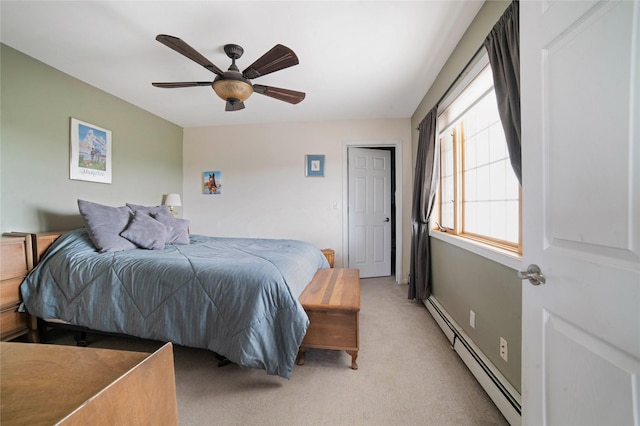 bedroom with a baseboard heating unit, ceiling fan, and light carpet