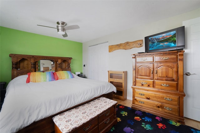 bedroom featuring ceiling fan and a closet