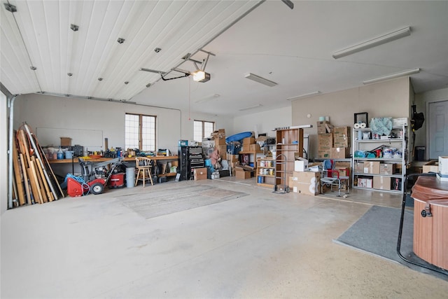 garage featuring a workshop area and a garage door opener