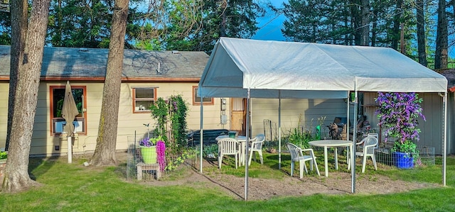 rear view of property with a yard