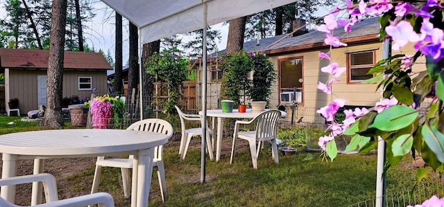 view of patio / terrace with an outbuilding