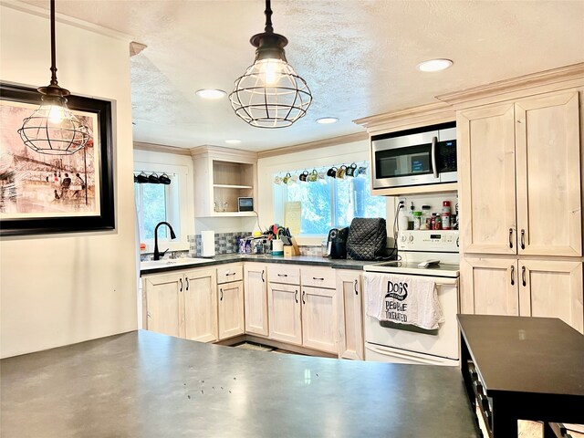 kitchen featuring sink, a textured ceiling, pendant lighting, and white electric stove