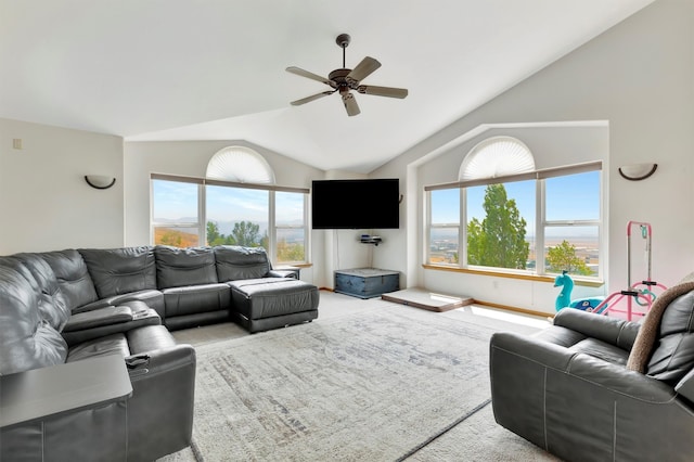 living room featuring vaulted ceiling, light colored carpet, and plenty of natural light