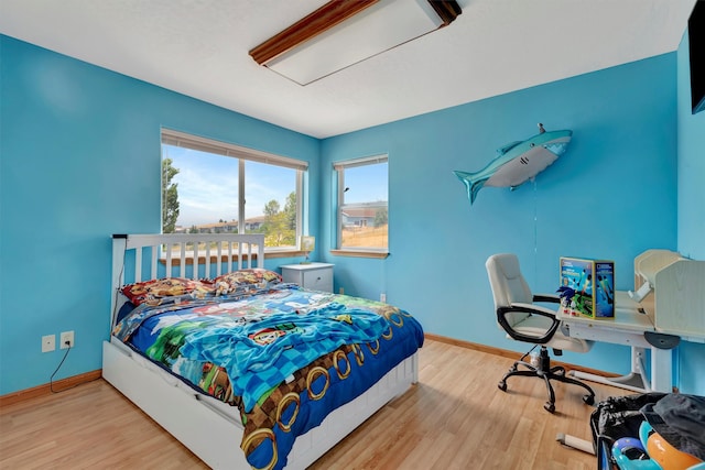 bedroom with light hardwood / wood-style floors