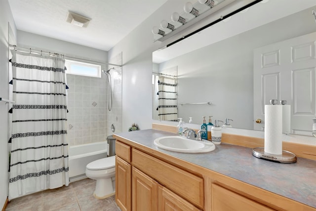 full bathroom featuring tile patterned floors, vanity, shower / tub combo, and toilet