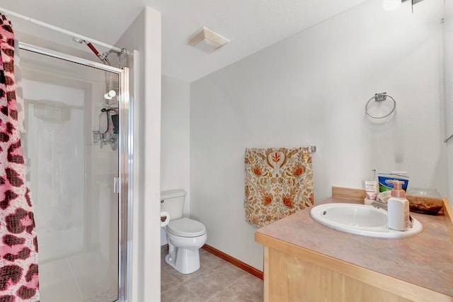 bathroom featuring a shower with shower door, vanity, tile patterned floors, and toilet