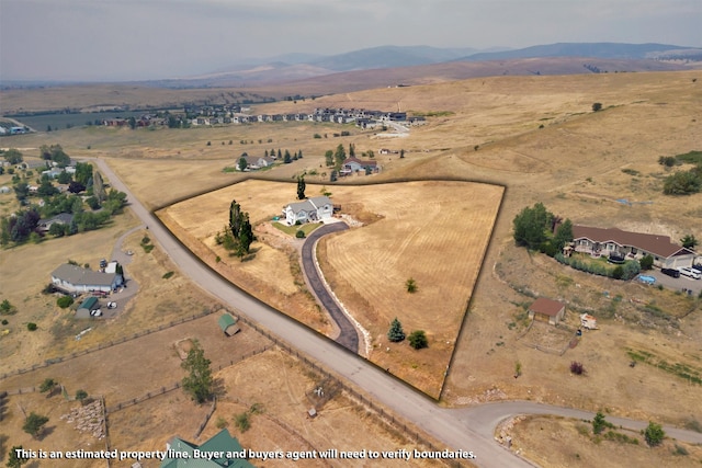 birds eye view of property with a rural view