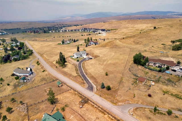 birds eye view of property with a mountain view and a rural view