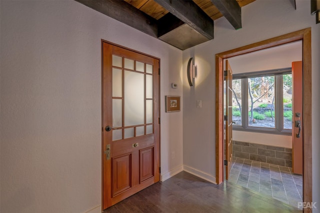 doorway to outside with beamed ceiling and dark hardwood / wood-style flooring