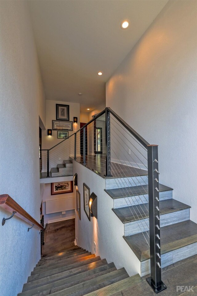 stairs with dark wood-type flooring