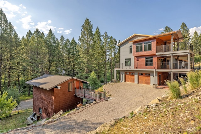 exterior space with a balcony and a garage