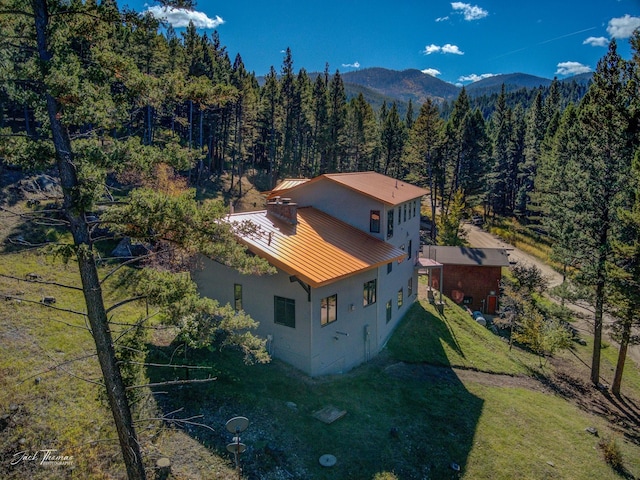 birds eye view of property with a mountain view