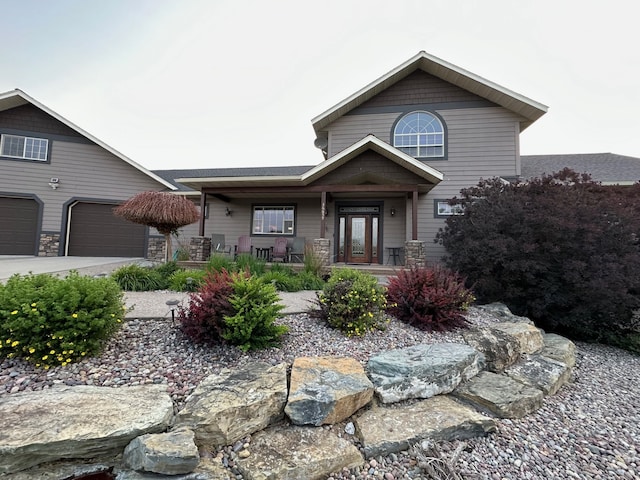 view of front of property featuring a garage and covered porch