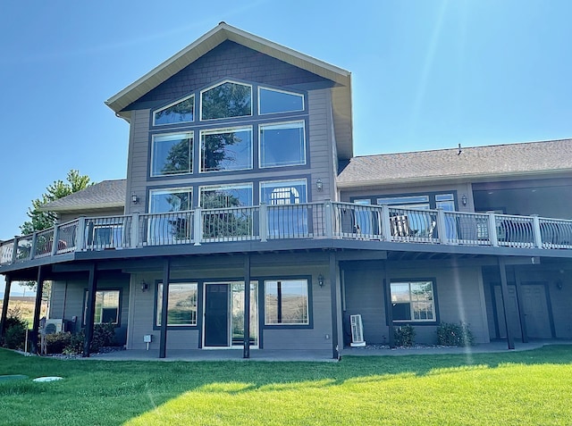 back of house featuring a yard and a deck