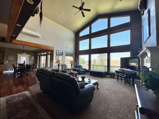 living room featuring dark hardwood / wood-style flooring, a towering ceiling, a wall mounted AC, and ceiling fan