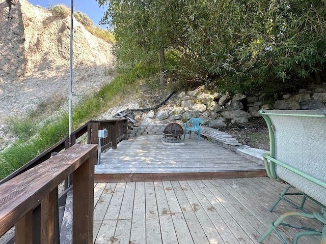 wooden deck featuring a fire pit