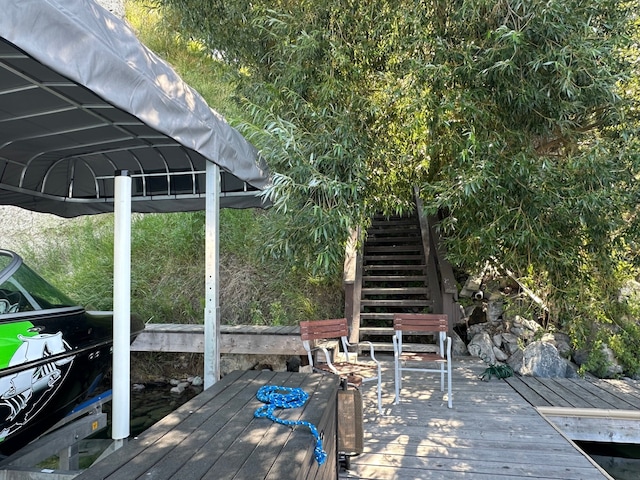 view of dock featuring stairway and a wooden deck