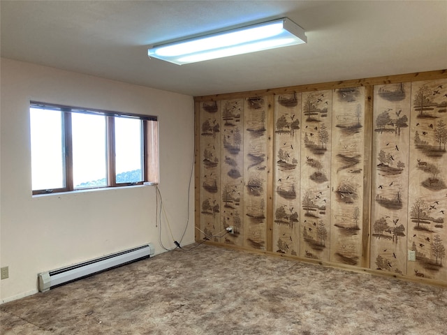 unfurnished room featuring a baseboard radiator and carpet floors