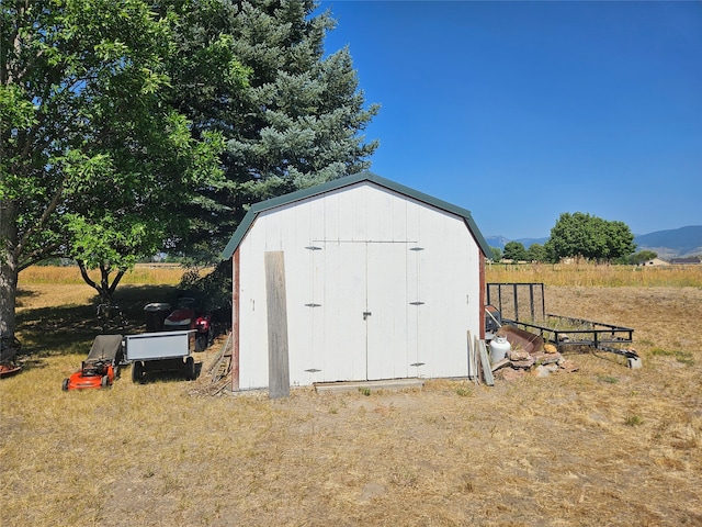 view of outbuilding featuring a mountain view