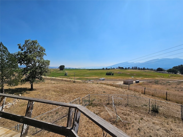 view of yard with a rural view