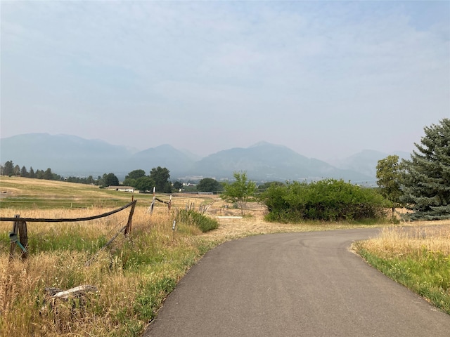 view of road with a mountain view and a rural view