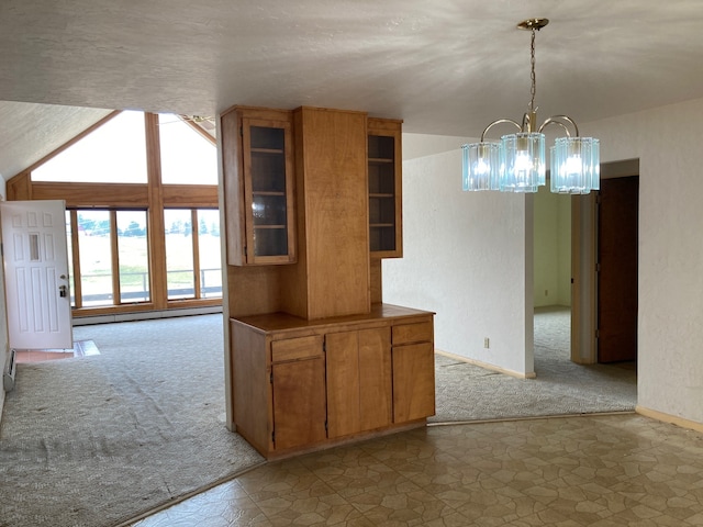 kitchen with a chandelier, light colored carpet, hanging light fixtures, and baseboard heating