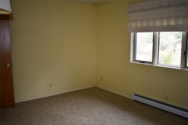 384 Eagle Ln, Corvallis, MT 59828 - empty room featuring a baseboard heating unit and carpet