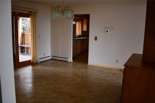 unfurnished dining area featuring a baseboard radiator, a chandelier, and sink