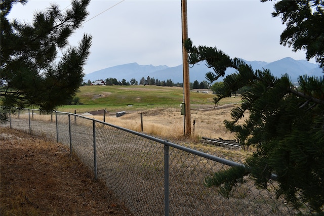 view of yard featuring a mountain view and a rural view