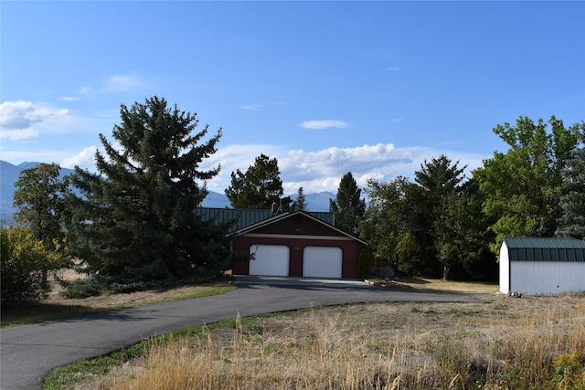 garage featuring a mountain view