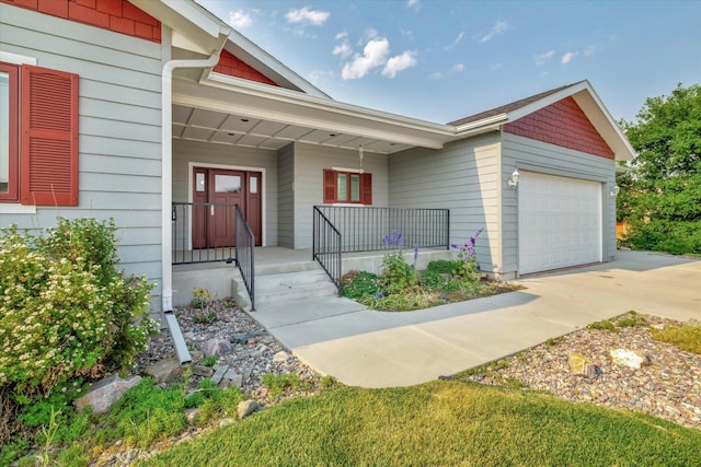 view of front of house featuring a garage and covered porch