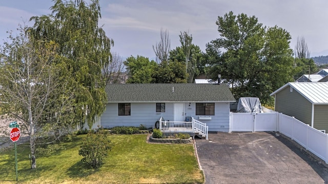 ranch-style house with a front lawn