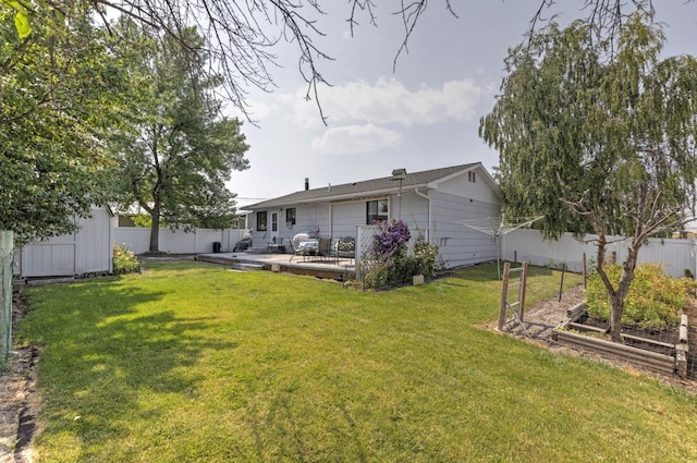 view of yard featuring a wooden deck and a storage unit