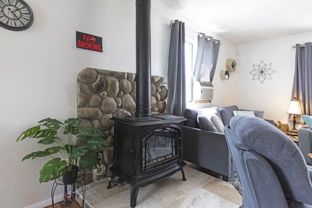 living room with a wood stove