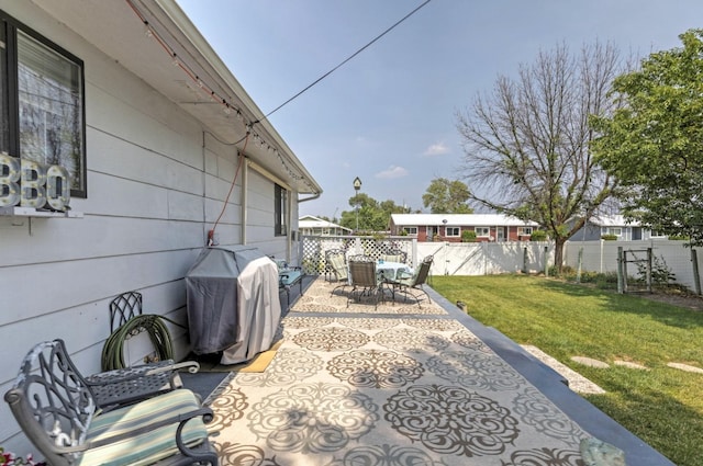 view of patio with a grill