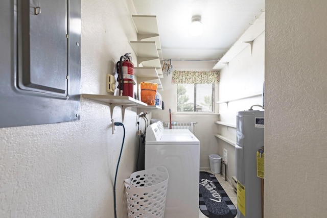 washroom with independent washer and dryer and water heater